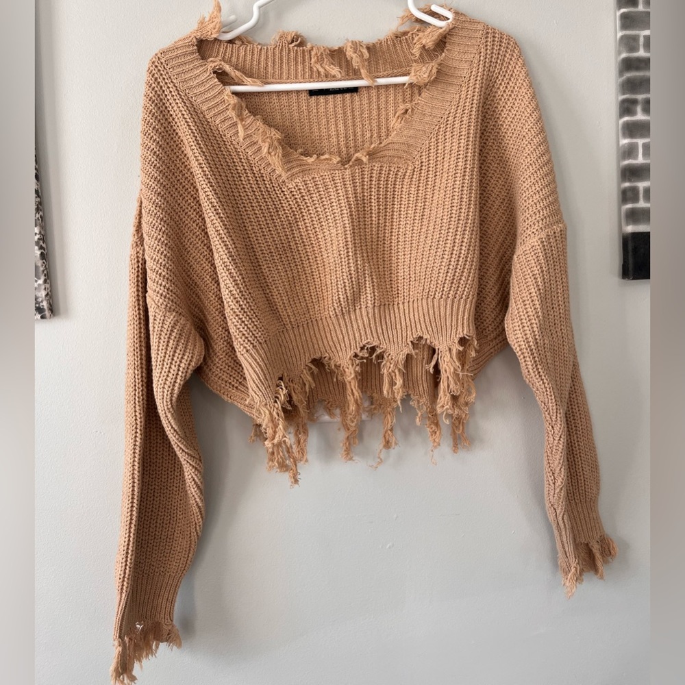 Brown knit cropped sweater.